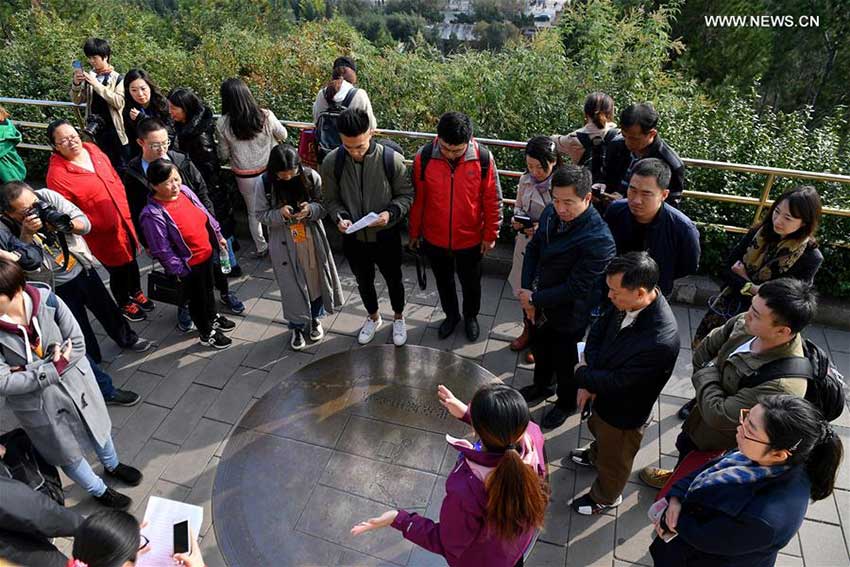 Journalists visit the Central Point of Beijing City in Jingshan Park in Beijing, capital of China, Oct. 12, 2017. The Press Center of the 19th National Congress of the Communist Party of China (CPC) organized a reporting tour along the Central Axis of Beijing on Thursday. Chinese and foreign reporters visited scenic attractions such as the Jingshan Park, Yongding Gate and the Olympic Tower. (Xinhua/Li Xin)