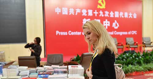 Books at 19th CPC National Congress Press Center popular among journalists