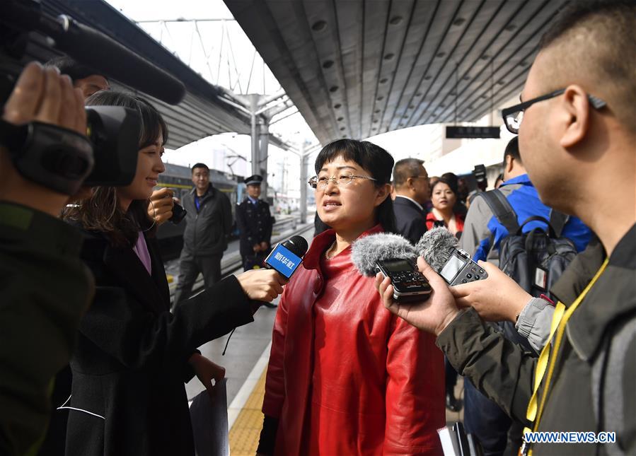 Xu Ye, a delegate of Shanxi Province to the 19th National Congress of the Communist Party of China (CPC), receives an interview upon her arrival in Beijing, capital of China, Oct. 15, 2017. Delegates of Shanxi Province to the CPC 19th National Congress arrived in Beijing on Sunday. The congress will start on Oct. 18. (Xinhua/Yan Yan)
