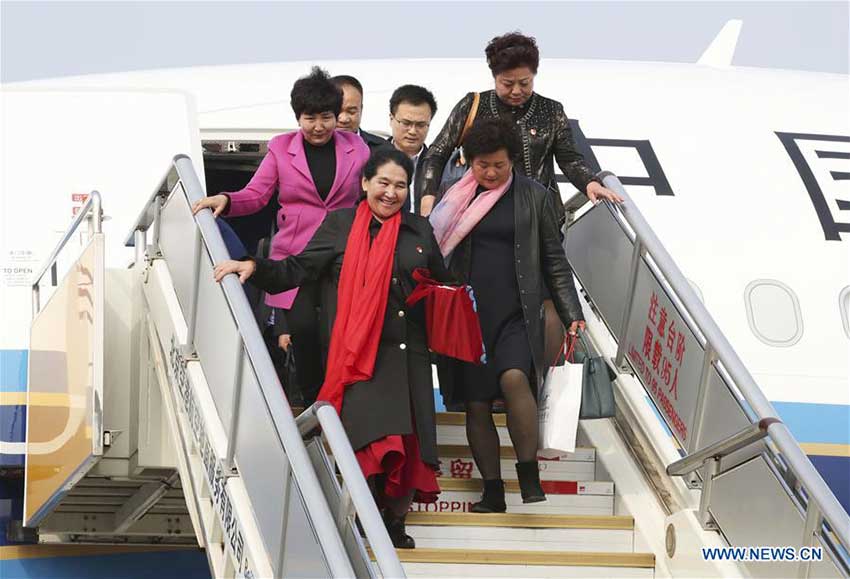 Delegates of Xinjiang Uygur Autonomous Region to the 19th National Congress of the Communist Party of China (CPC) arrive at Capital International Airport in Beijing, capital of China, Oct. 15, 2017. The congress will start on Oct. 18. (Xinhua/Xie Huanchi)
