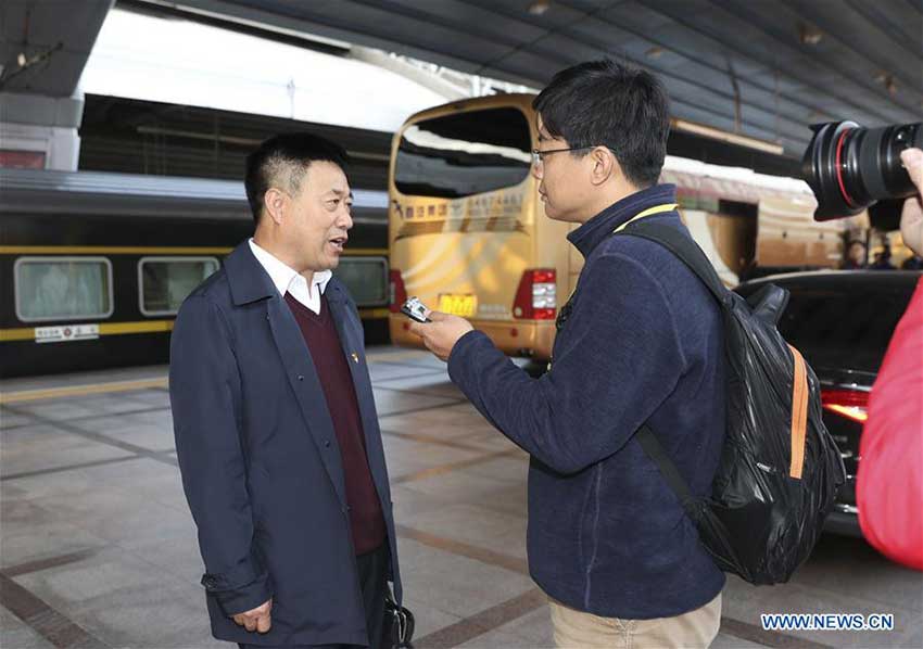 Li Fengyu (L), a delegate of Heilongjiang Province to the 19th National Congress of the Communist Party of China (CPC), receives an interview upon his arrival in Beijing, capital of China, Oct. 16, 2017. Delegates of Heilongjiang Province to the 19th CPC National Congress arrived in Beijing on Monday. The congress will start on Oct. 18 in Beijing. (Xinhua/Ding Haitao)
