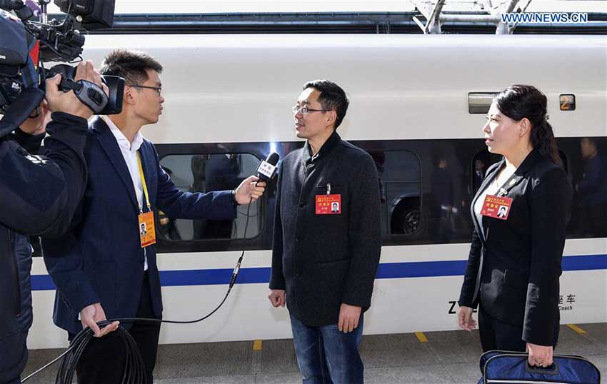 Zhang Xuesong (2nd R) and Chen Linjing (1st R), delegates of Hebei Province to the 19th National Congress of the Communist Party of China (CPC), receive interviews upon their arrival in Beijing, capital of China, Oct. 16, 2017. Delegates of Hebei Province to the 19th CPC National Congress arrived in Beijing on Monday. The congress will start on Oct. 18 in Beijing. (Xinhua/Zhang Ling)