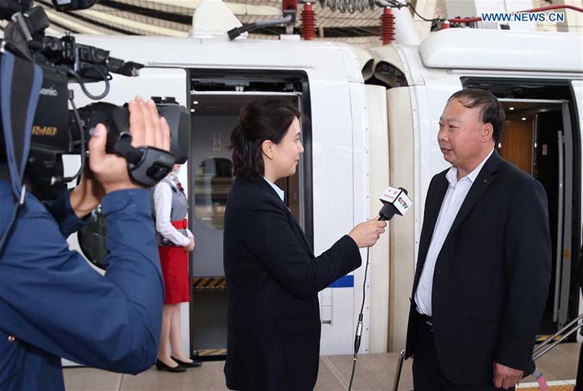 Pi Jinjun (1st R), a delegate of Shandong Province to the 19th National Congress of the Communist Party of China (CPC), receives an interview upon his arrival in Beijing, capital of China, Oct. 16, 2017. Delegates of Shandong Province to the 19th CPC National Congress arrived in Beijing on Monday. The congress will start on Oct. 18 in Beijing. (Xinhua/Jin Liwang)