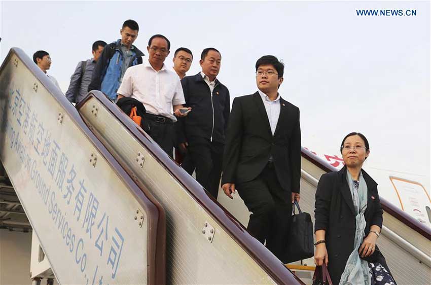 Delegates of Hainan Province to the 19th National Congress of the Communist Party of China (CPC) arrive at Capital International Airport in Beijing, capital of China, Oct. 16, 2017. The congress will start on Oct. 18 in Beijing. (Xinhua/Yin Gang)