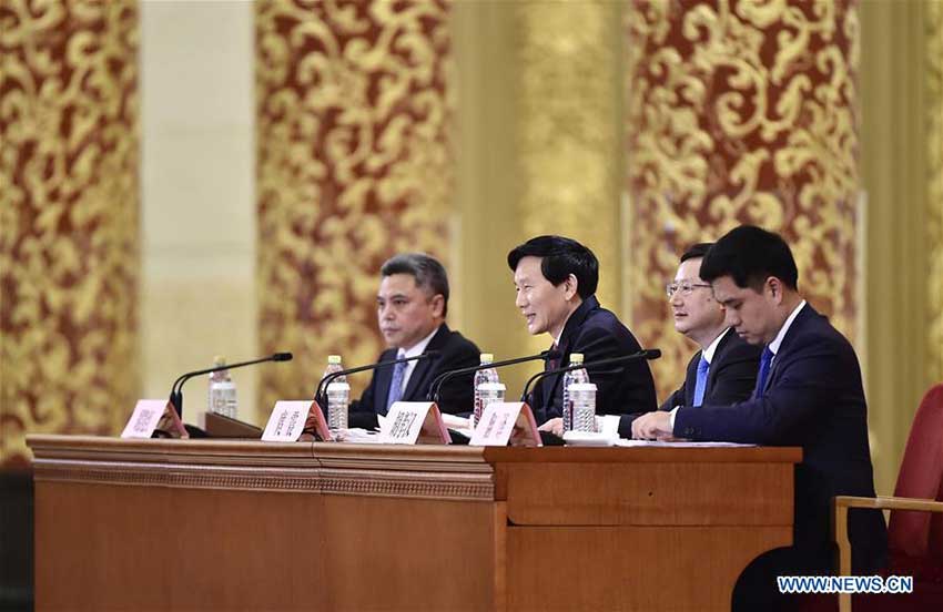 Tuo Zhen (2nd L), spokesperson for the 19th National Congress of the Communist Party of China, holds a press conference at the Great Hall of the People in Beijing, capital of China, Oct. 17, 2017, briefing the media on the upcoming congress. (Xinhua/Liu Jinhai) 