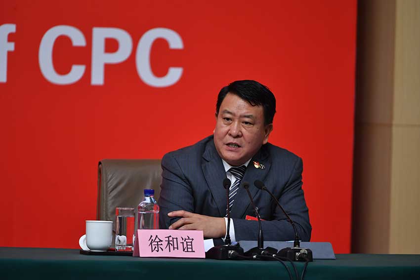 Xu Heyi answers questions during a group interview held by the press center of the 19th National Congress of the Communist Party of China (CPC) on pursuing a new type of industrialization, in Beijing, capital of China, Oct. 19, 2017. Xu is the chairman of Beijing Automotive Group Co,. Ltd. and secretary of the Party committee of the company. (People's Daily Online Photo)