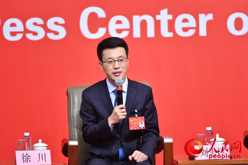 Xu Chuan, Party chief of the School of Marxism Studies of the Nanjing University of Aeronautics and Astronautics, answers questions during a group interview held by the press center of the 19th National Congress of the Communist Party of China (CPC) on comprehensive educational reforms in Beijing, capital of China, Oct. 22, 2017.
