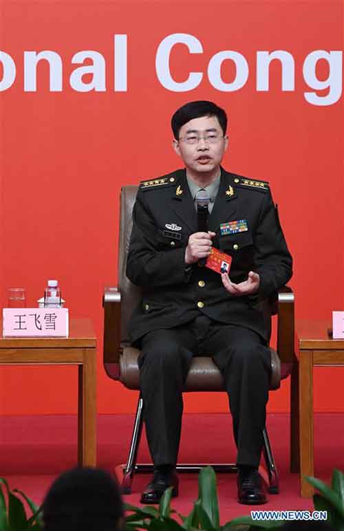 Wang Feixue, a professor from the National University of Defense Technology, answers questions during a group interview on "solid strides on the path of building a powerful military with Chinese characteristics", held by the press center of the 19th National Congress of the Communist Party of China (CPC) in Beijing, capital of China, Oct. 22, 2017. (Xinhua/Chen Yehua)