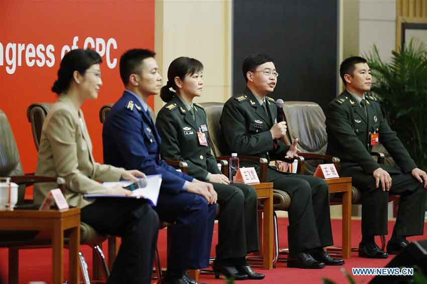 The press center of the 19th National Congress of the Communist Party of China (CPC) holds a group interview on "solid strides on the path of building a powerful military with Chinese characteristics" in Beijing, capital of China, Oct. 22, 2017. Liu Rui, an aviation regiment commander of the People's Liberation Army (PLA) Air Force, Liu Fang, a staff officer of the Office for International Military Cooperation of the Central Military Commission, Wang Feixue, a professor from the National University of Defense Technology, and Wang Rui, a commander of an armored amphibious assault vehicle of a combined arms brigade in the 74th Army corps of the PLA, were present at the group interview. (Xinhua/Shen Bohan)